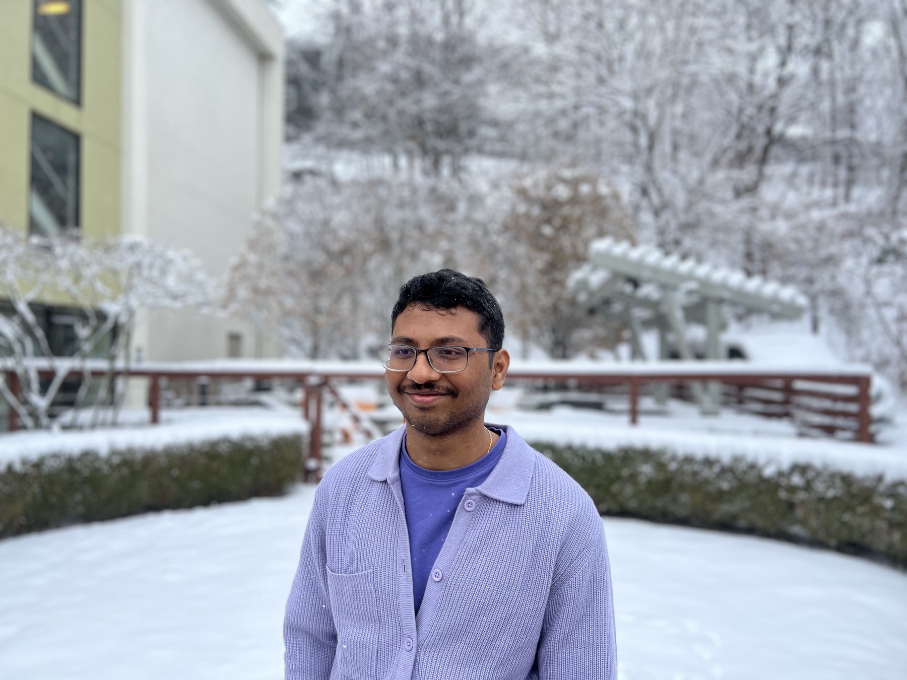 Dinesh Kumar standing outdoors on a snowy day